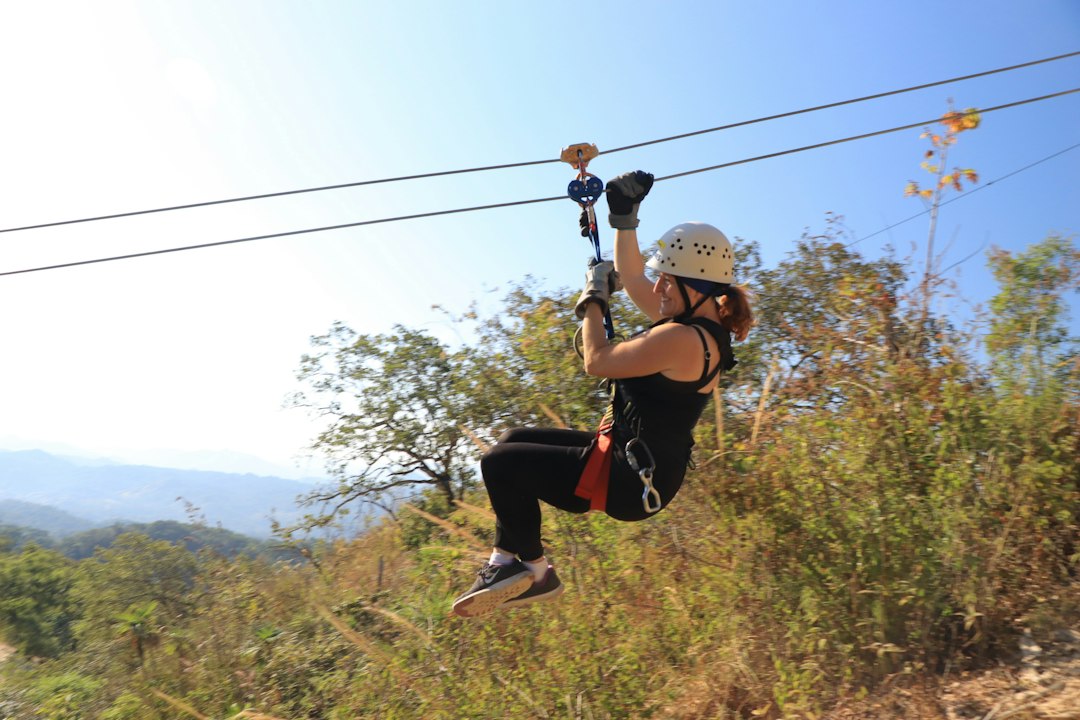 A woman ziplining through the jungle in Mexico